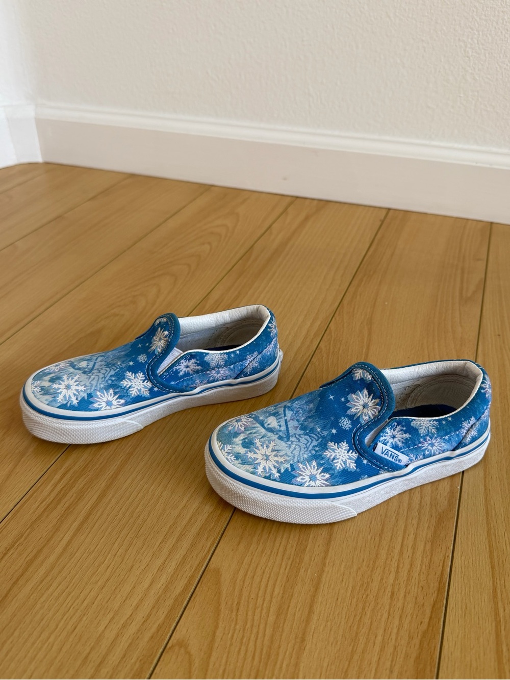 Vans Kids Slip-On Sneakers in Blue with White Snowflake Print